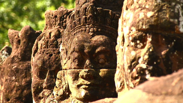 Zoom out - Stone Carving of Buddha God on Bridge - Angkor Wat, Cambodia