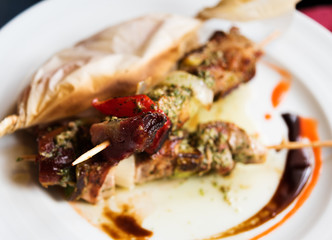 Grilled meat skewers with vegetables