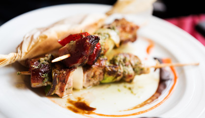 Grilled meat skewers with vegetables