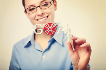 Smiling Businesswoman Writing Goal Text