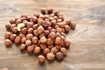 Hazelnuts on wooden surface