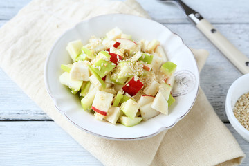 Salad with apples and celery on a plate