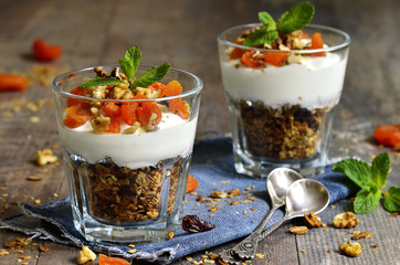 Dessert from granola,yogurt,nuts and dried apricot.
