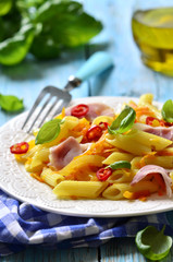 Penne with fried vegetable and smoked bacon.