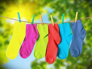 colorful socks hanging from a rope