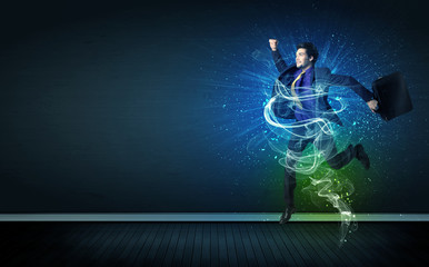 Talented cheerful businessman jumping with glowing energy lines