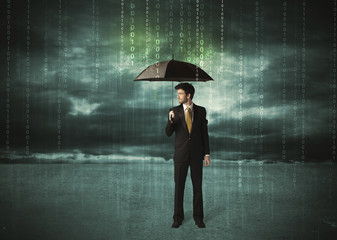 Business man standing with umbrella data protection concept