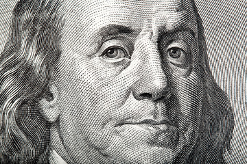Close-up portrait of Franklin on American money. - obrazy, fototapety, plakaty