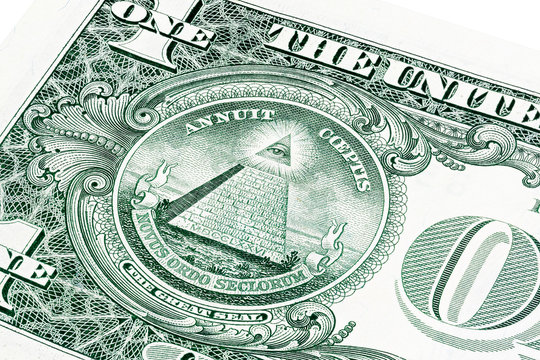 U.S. one (1) dollar bill in a close-up photo.