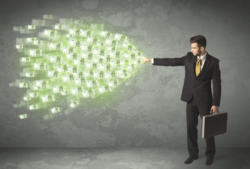 Young business person throwing money concept
