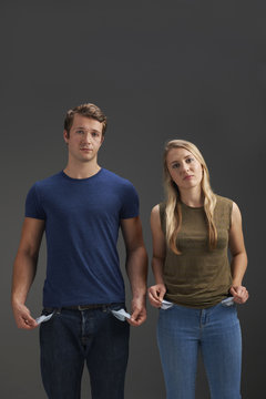 Young Couple With Empty Pockets And No Money
