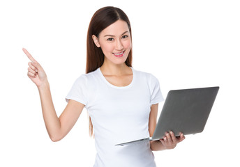 Woman hold with laptop and finger point up