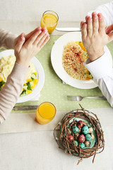 People praying before eating, top view