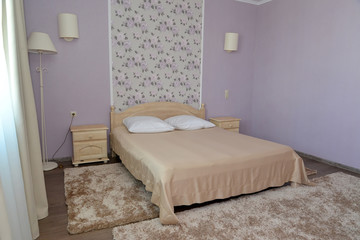 Interior of a bedroom of a double hotel room in light tones