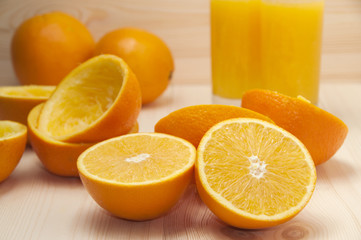 Orange slices for squeezing and fresh orange juice