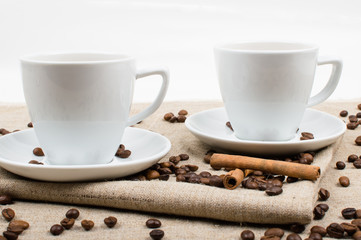 Coffee cup and beans on a white background.