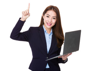 Businesswoman use of laptop and finger point up