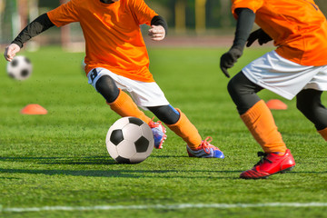 Football soccer match for children. Boys playing football
