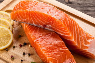 Fresh raw salmon fillet on cutting board