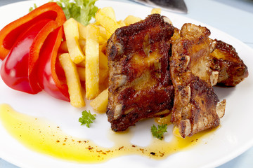 Grilled ribs on plate