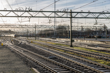 Railway tracks in morning sun at the Dutch station of The Hague