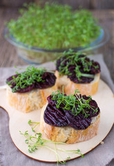 Bruschetta with roasted beet and watercress salad