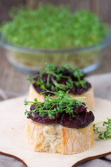 Bruschetta with roasted beet and watercress salad