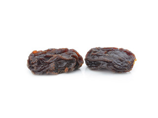 Dried raisins on a white background