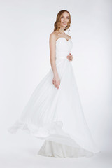 Fototapeta na wymiar Elegant Bride in Long Bridal Dress