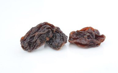 Dried raisins on a white background