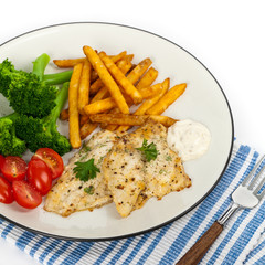 Fried Catfish fillet with vegetables on white background