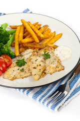 Fried Catfish fillet with vegetables on white background