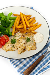 Fried Catfish fillet with vegetables on white background