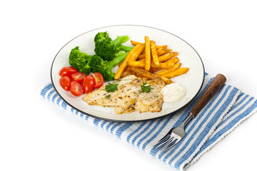 Fried Catfish fillet with vegetables on white background