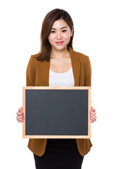Young businesswoman show with chalkboard