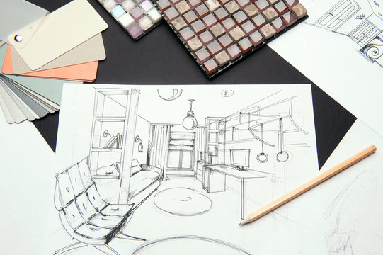 On the table are a drawing of pencil-drawn design room design. In the frame, a sheet of paper on a black background, a pencil and samples of the palette and mosaic.
