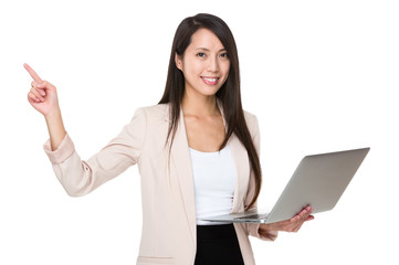 Businesswoman hold with laptop and finger point up