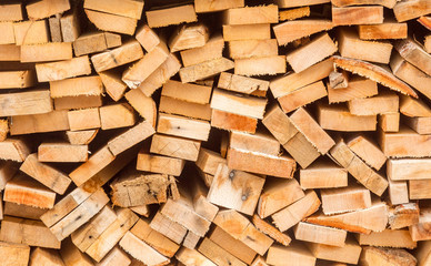 chopped wood stacked in pile for winter