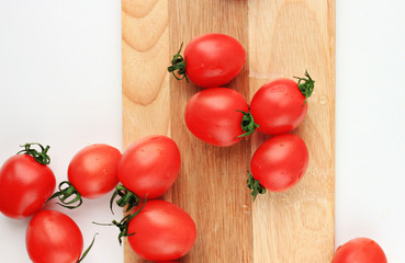 tomatoes cherry on wooden white background