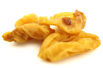 dried pear halves on a white background