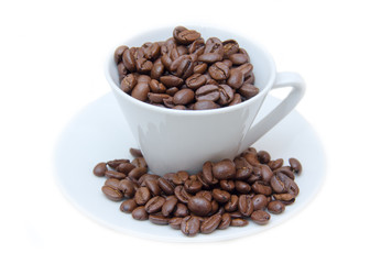 Cup with coffee beans on white background
