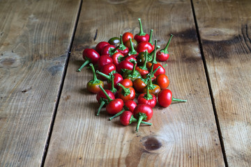 Chili peppers on wooden background