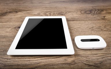 Mobile router with tablet pc. 3G or LTE network concept.