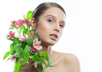 Beauty Portrait. Beautiful Spa Woman with flowers in shoulders.