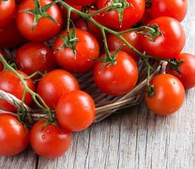 Cherry tomatoes on wood background