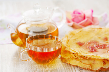 crepes, cup of tea and rose petal jam