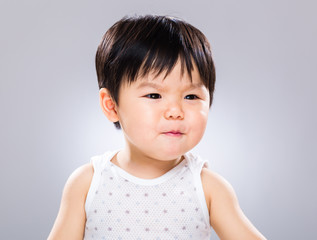 Asian baby with funny facial expression