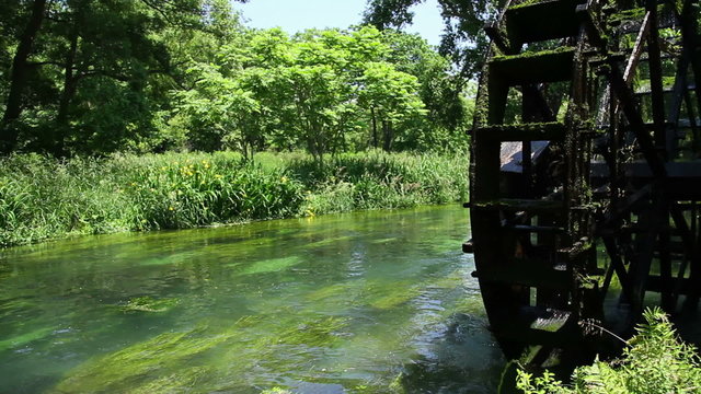 water wheel and clear stream