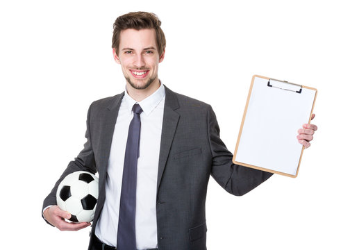 Football manager hold with soccer and clipboard
