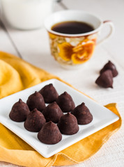truffle chocolates with a cup of coffee and cream